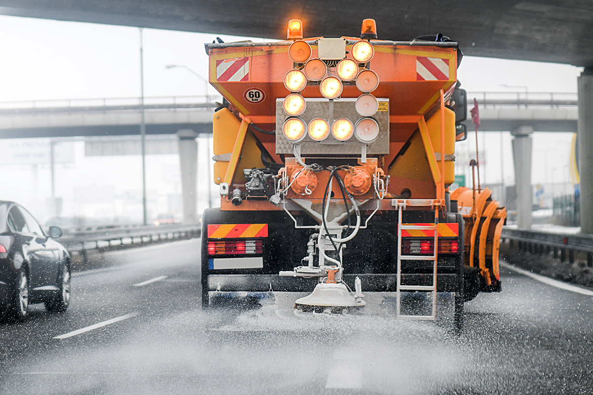 road-ice-grit-truck-cars-bridge